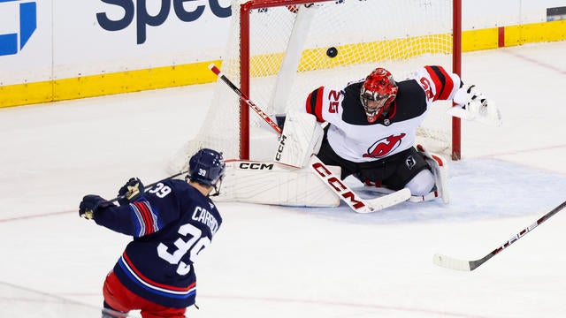 New York Rangers Center Sam Carrick (39) scores the winning goal during overtime in the National Hockey League game between the New Jersey Devils and the New York Rangers on January 9, 2025 at Madison Square Garden in New York, NY. 