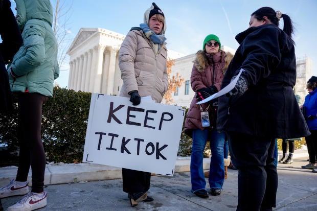 Content creators stand outside the Supreme Court during oral arguments on whether to overturn or delay a law that could lead to a ban of TikTok in the U.S., on Jan. 10, 2025, in Washington, D.C. 