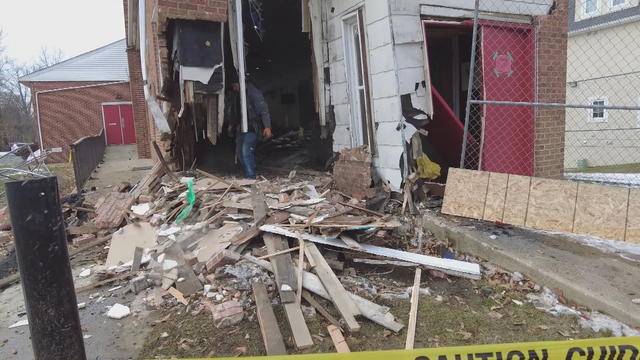 Beams and debris are seen outside the church after the crash 