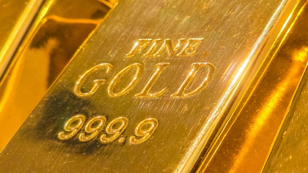 A fine gold bar with the number 999.99 on it.
