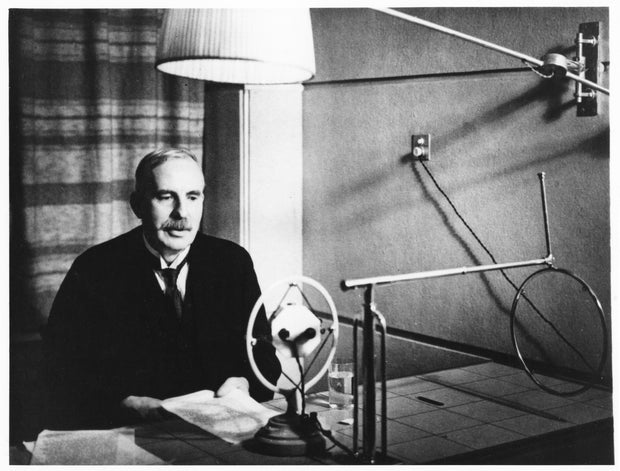 Ernest Rutherford broadcasting during a home visit to New Zealand in 1926. Artist: Anon