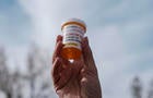 WASHINGTON, US - DECEMBER 4: A protestor holds a bottle of oxyc 