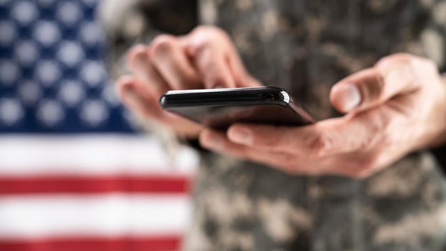 Soldier Holding Mobile Phone 