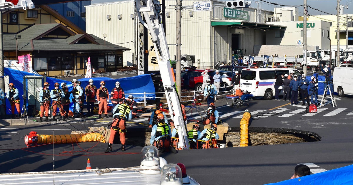 Massive sinkhole swallows truck in Japan, trapping driver inside