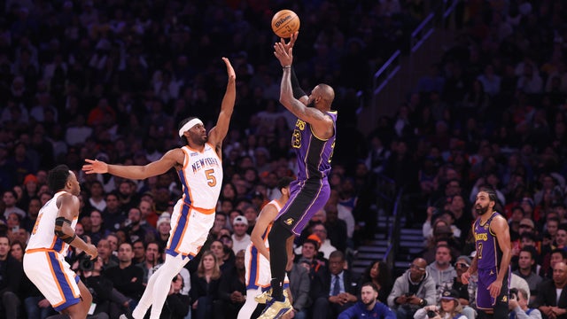 LeBron James #23 of the Los Angeles Lakers shoots against Precious Achiuwa #5 of the New York Knicks during their game at Madison Square Garden on February 01, 2025 in New York City. 