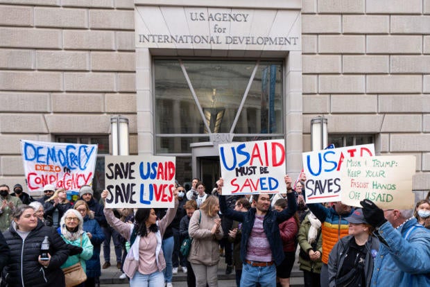 Employees and supporters protest outside the USAID headquarters on Monday, Feb. 3, 2025. 