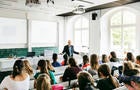 University Professor Addressing His Pupils During Lecture 