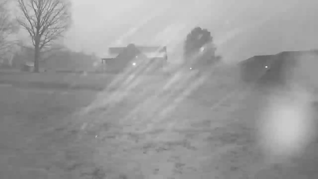 Lightning flashes at a farm in Deer Lodge, Tennessee, as a storm moves through the area, in an image capture from video posted to social media Feb. 7, 2025. 