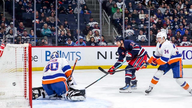 Gabriel Vilardi #13 of the Winnipeg Jets redirects the puck past goaltender Ilya Sorokin #30 of the New York Islanders for a second period goal at the Canada Life Centre on February 7, 2025 in Winnipeg, Manitoba, Canada. 