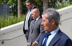 Walt Nauta, middle, leaves the federal Courthouse in Fort Pierce, Florida, on Aug. 10, 2023, with his attorney Stanley Woodward. Mar-a-Lago property manager Carlos De Oliveira is in the foreground. 