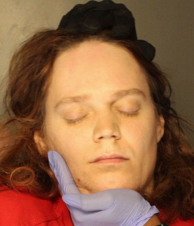 Jack LaSota refused to speak and kept her eyes closed while being photographed for a booking photo in Pennsylvania 