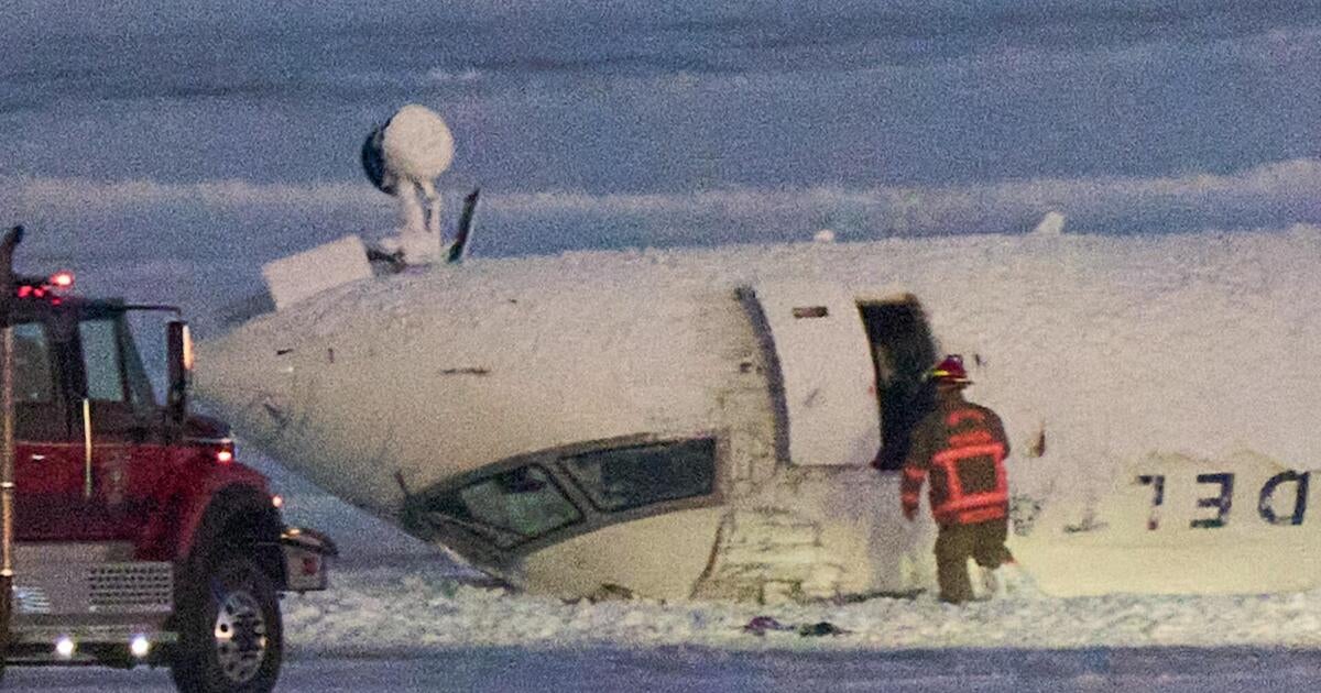 Delta plane crash survivor described hanging upside down after Toronto landing