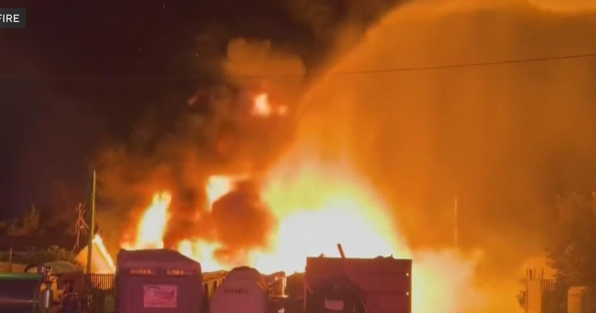 Modesto firefighters investigating fire at a commercial yard