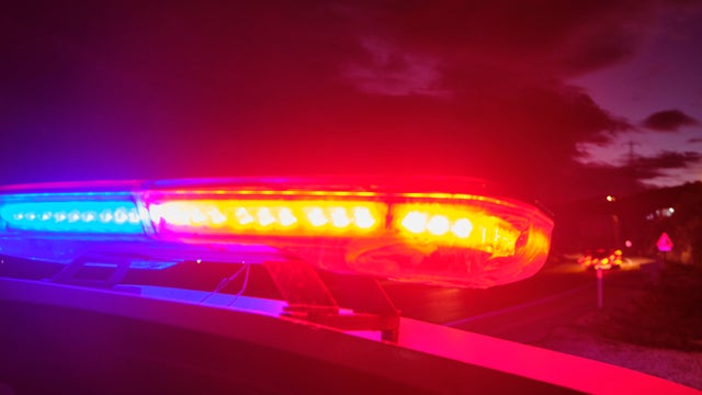 police car flashing lights in the night selective focus