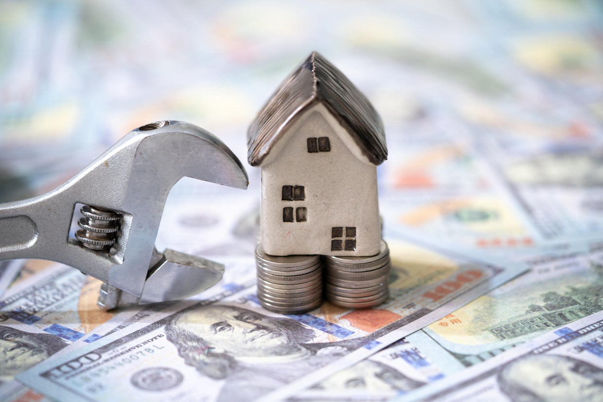 Home repair concept,home improvement loan,Home model with dollar,home loan rate,Home insurance concept, 