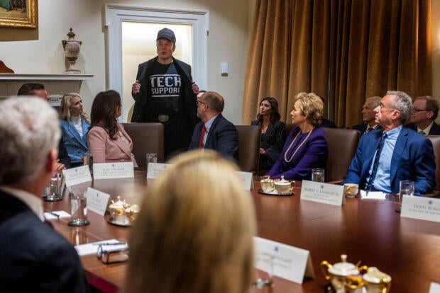 Elon Musk wears a "Tech Support" shirt as he speaks during a Cabinet meeting at the White House in Washington, D.C., on Feb. 26, 2025. 