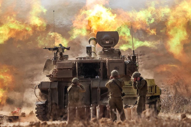 An Israeli army M109 155mm automatic howitzer opened fire near the Gaza border in southern Israel on October 11, 2023.
