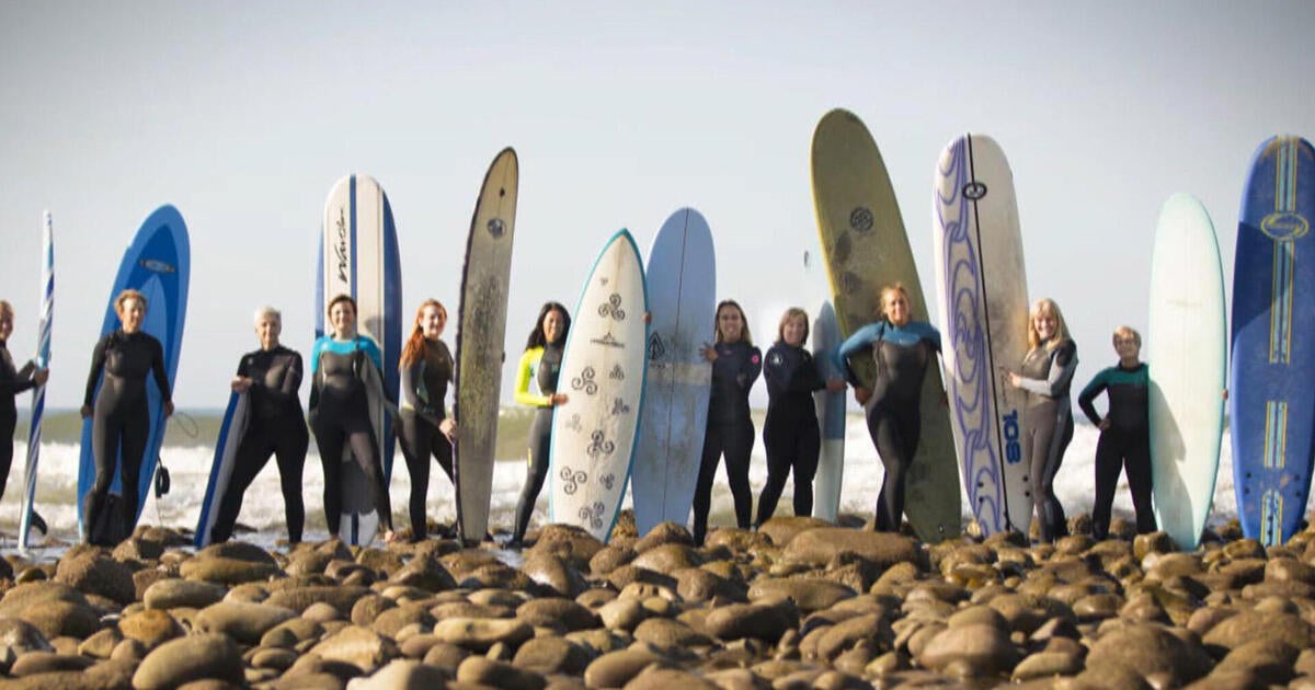 How a group of moms became the "Salt Water Divas" surf crew