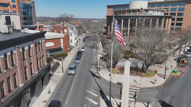 Drone photo of an American flag waving over Doylestown, Pennsylvania 