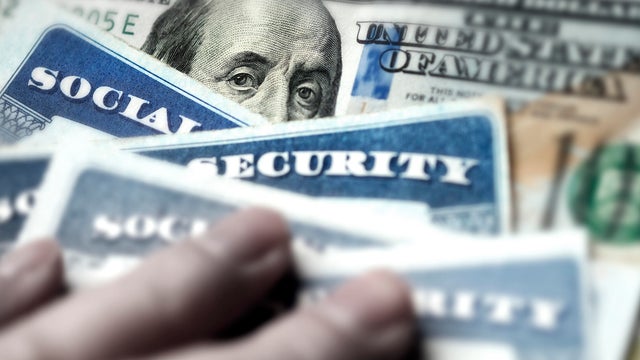 Social Security Cards with US One Hundred Dollar Bill $100 