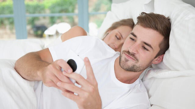 Man in Bed Using Smartphone 