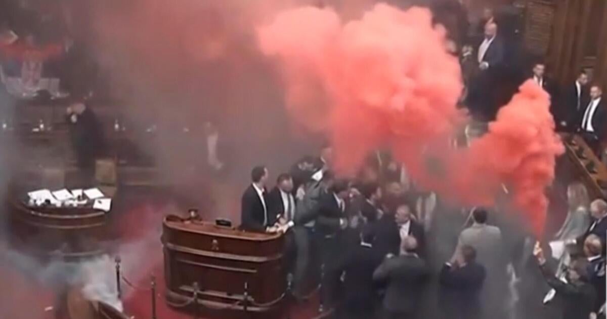 Serbian parliament erupts into chaos as smoke grenades, tear gas clash ensues