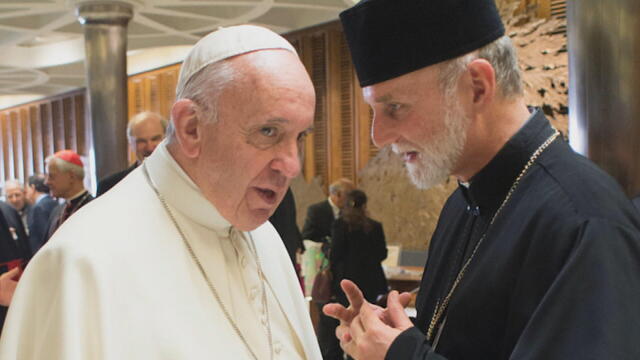 Pope Francis speaks to Archbishop Borys Gudziak during an event 