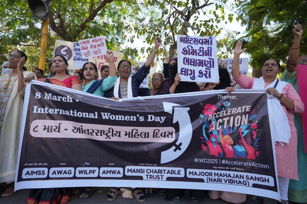 Women shout slogans during a demonstration to mark International Women's Day in Ahmedabad, India, Saturday, March 8, 2025