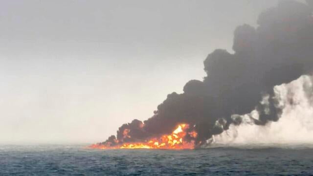 This image provided by Bartek Śmiałek shows smoke billowing from a vessel after a cargo ship hit a tanker carrying jet fuel off eastern England on March 10, 2025, setting both ablaze. 