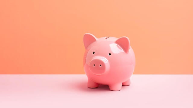 Pink piggybank on pastel background with copy space. Finance, technology, business analysis concept 