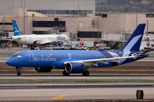 A Breeze Airways Airbus A220 taxis at Los Angeles International Airport after arrival on Sept. 19, 2024, in Los Angeles, California. 