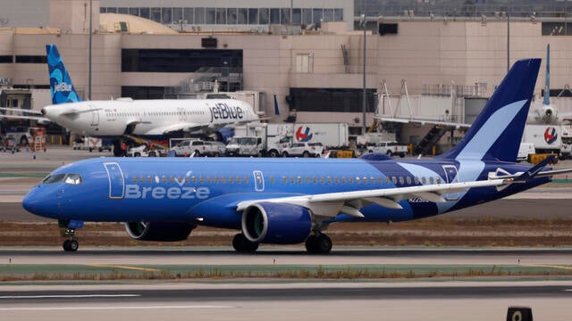 A Breeze Airways Airbus A220 taxis at Los Angeles International Airport after arrival on Sept. 19, 2024, in Los Angeles, California. 