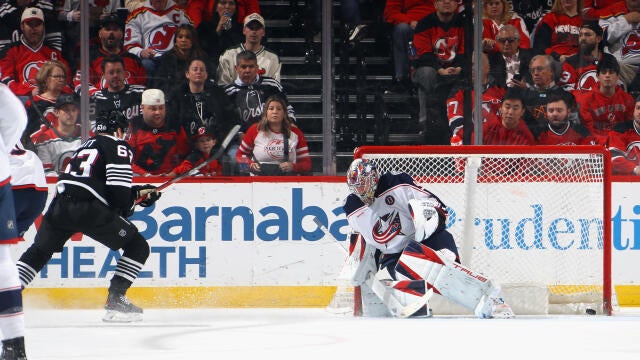 Jesper Bratt #63 of the New Jersey Devils scores a first period goal against Elvis Merzlikins #90 of the Columbus Blue Jackets at Prudential Center on March 11, 2025 in Newark, New Jersey. 