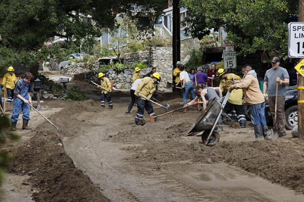 Storm clean-up where there was heavy mudflow from heavy rains on Woodland Drive in Sierra Madre 