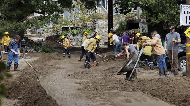 Storm clean-up where there was heavy mudflow from heavy rains on Woodland Drive in Sierra Madre 