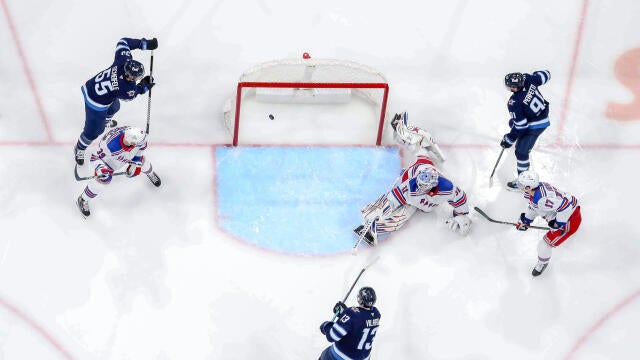 Gabriel Vilardi #13 of the Winnipeg Jets shoots the puck past goaltender Igor Shesterkin #31 of the New York Rangers into the open net for a second period goal at the Canada Life Centre on March 11, 2025 in Winnipeg, Manitoba, Canada. 