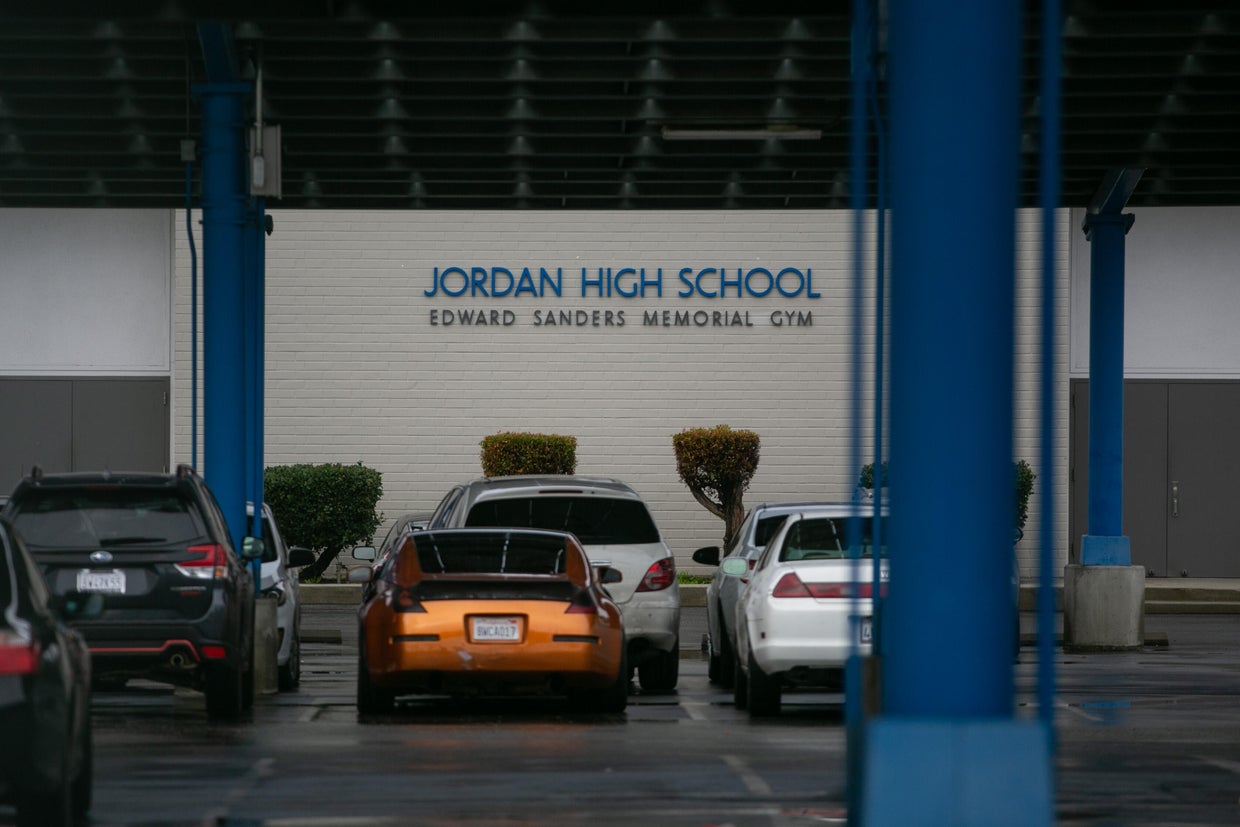 Jordan High School students and community members protest in front of Atlas Iron and Metal Company that is located next door to the school 