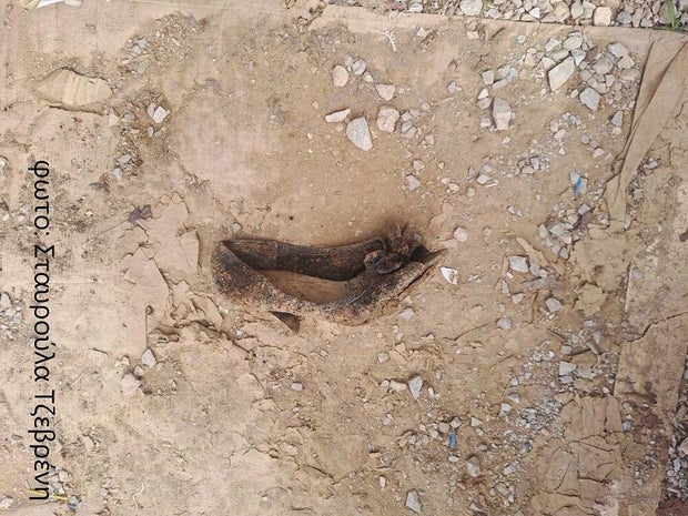 The bodies found in Greece Mass had 3 woman-shoe-download.jpg