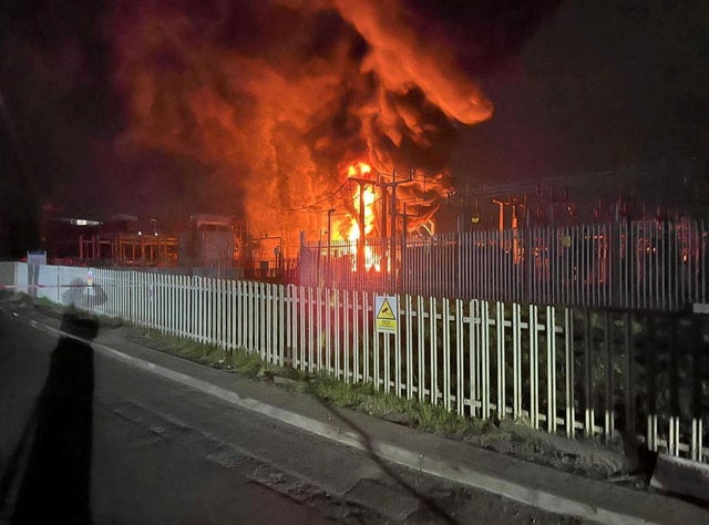 Fire, which wiped out power and closed Heathrow Airport, rises at the North Hyde Electricity Substation in Hayes 