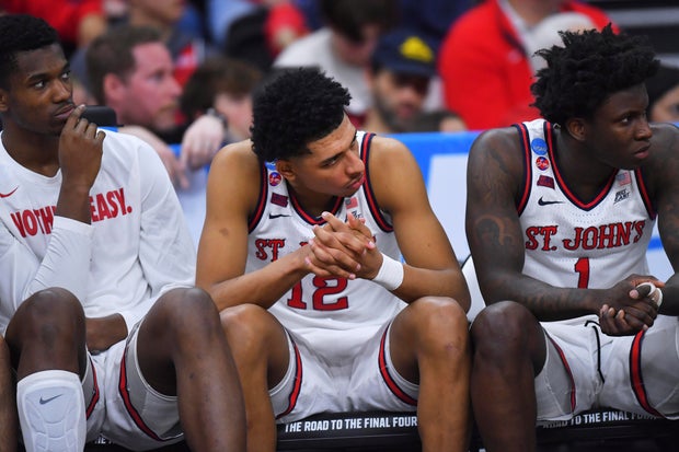 St. John's guard RJ Luis Jr. (12) sits on the bench while trailing Arkansas late in the second half in the second round of the NCAA college basketball tournament, Saturday, March 22, 2025, in Providence, R.I.