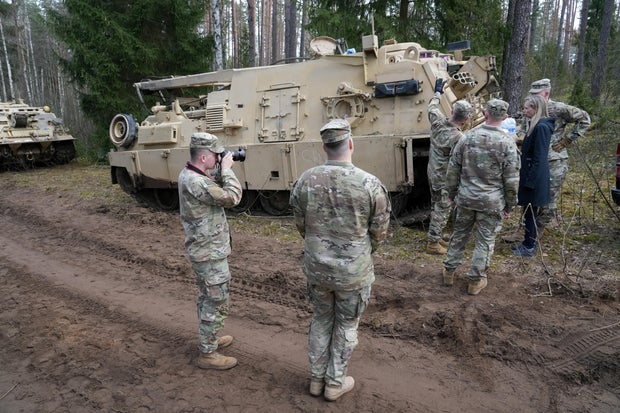 Rescuers dig for missing U.S. soldiers' vehicle in Lithuania 
