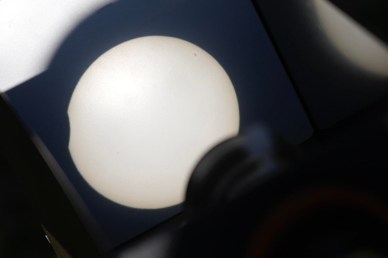 See photos of the March partial solar eclipse, where the moon passes in ...