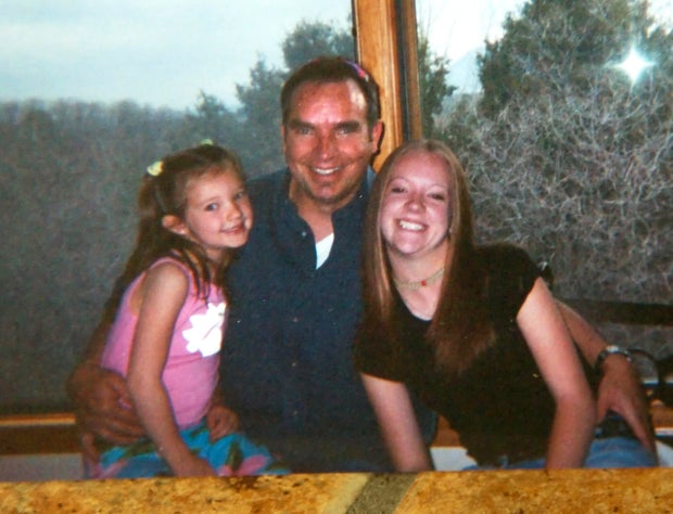 Donald "Donnie" Young and his and his two daughters Kelsey, left, and Kourtney, right, in this recent undated photo. Donald was shot and killed in 2005.