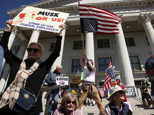 People participate in a protest, in a demonstration that is part of larger "Hands off" events organized nationwide against U.S. President Trump, in Salt Lake City 