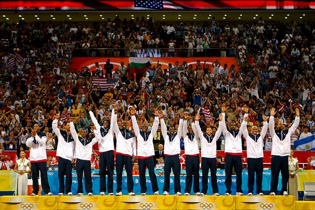The U.S. men's basketball team stand on the medal stand duri 