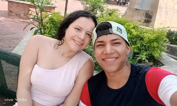 Franco Caraballo takes a selfie with his wife 