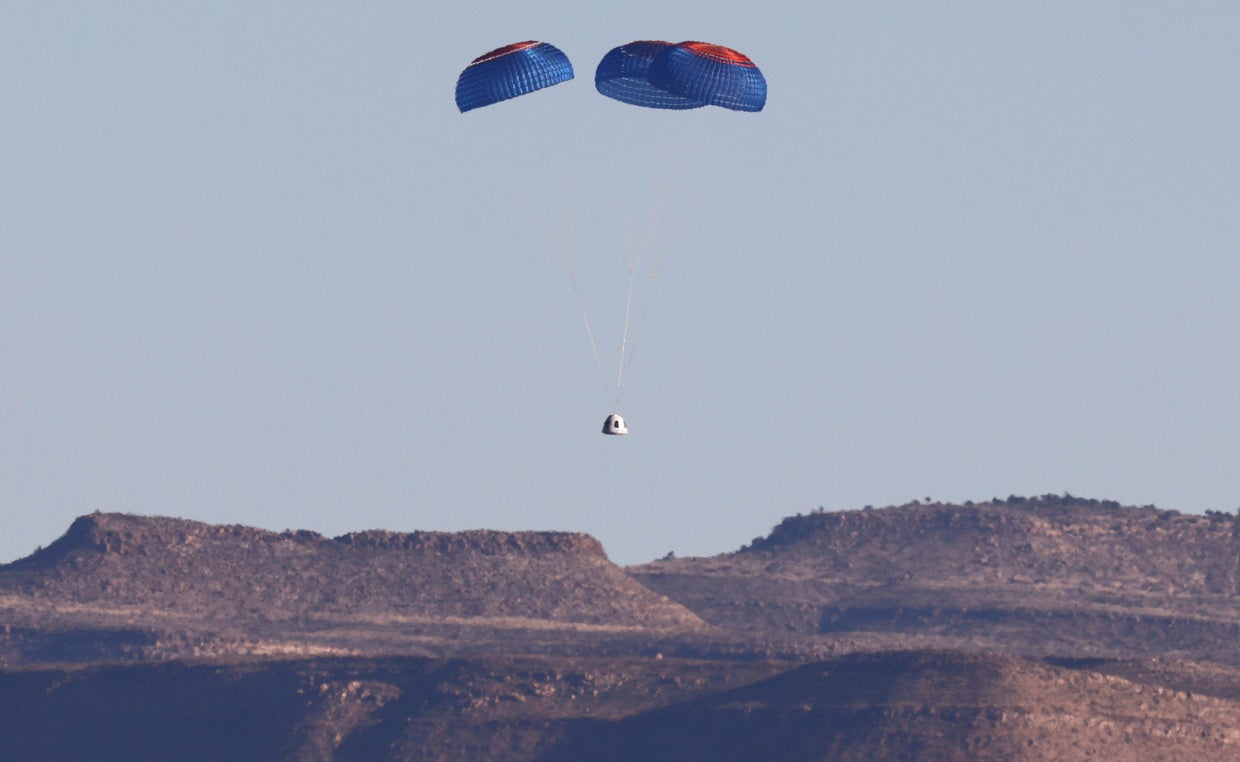Blue Origin crew capsule descends with its parachute after a flight