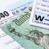 IRS tax forms with tax refund check 