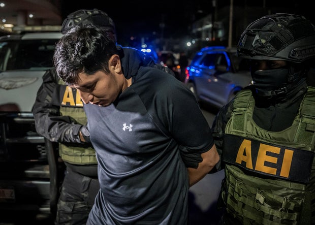 Members of the State Security Agency escort U.S. citizen who shot and killed a state Mexican police officer, in Tijuana 