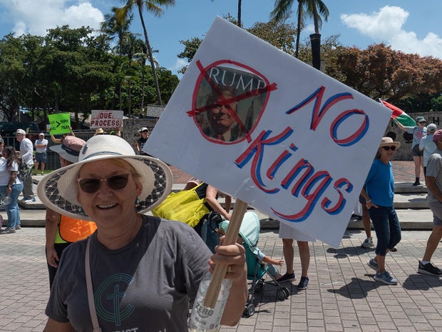 Protesters rally in Miami against Trump administration ahead of 100th day in office 